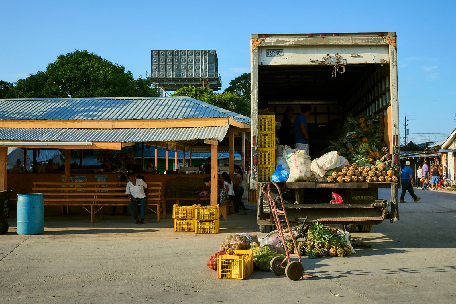 Vendors unloading at the local market in Orange Walk Town.